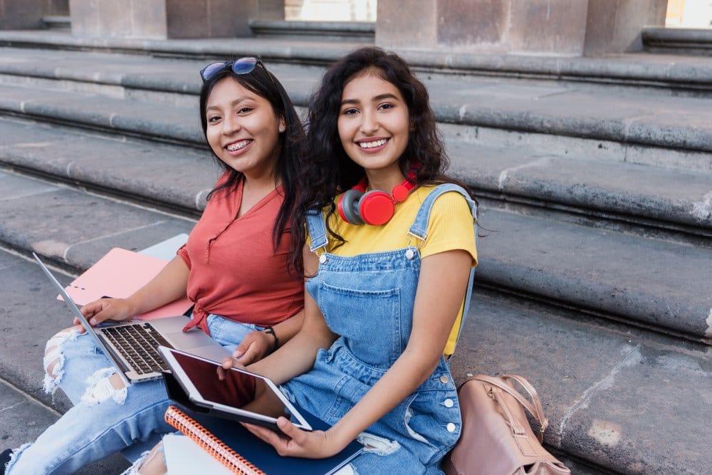 portrait of two young latin girls university students in Mexico Latin America, hispanic girls studying